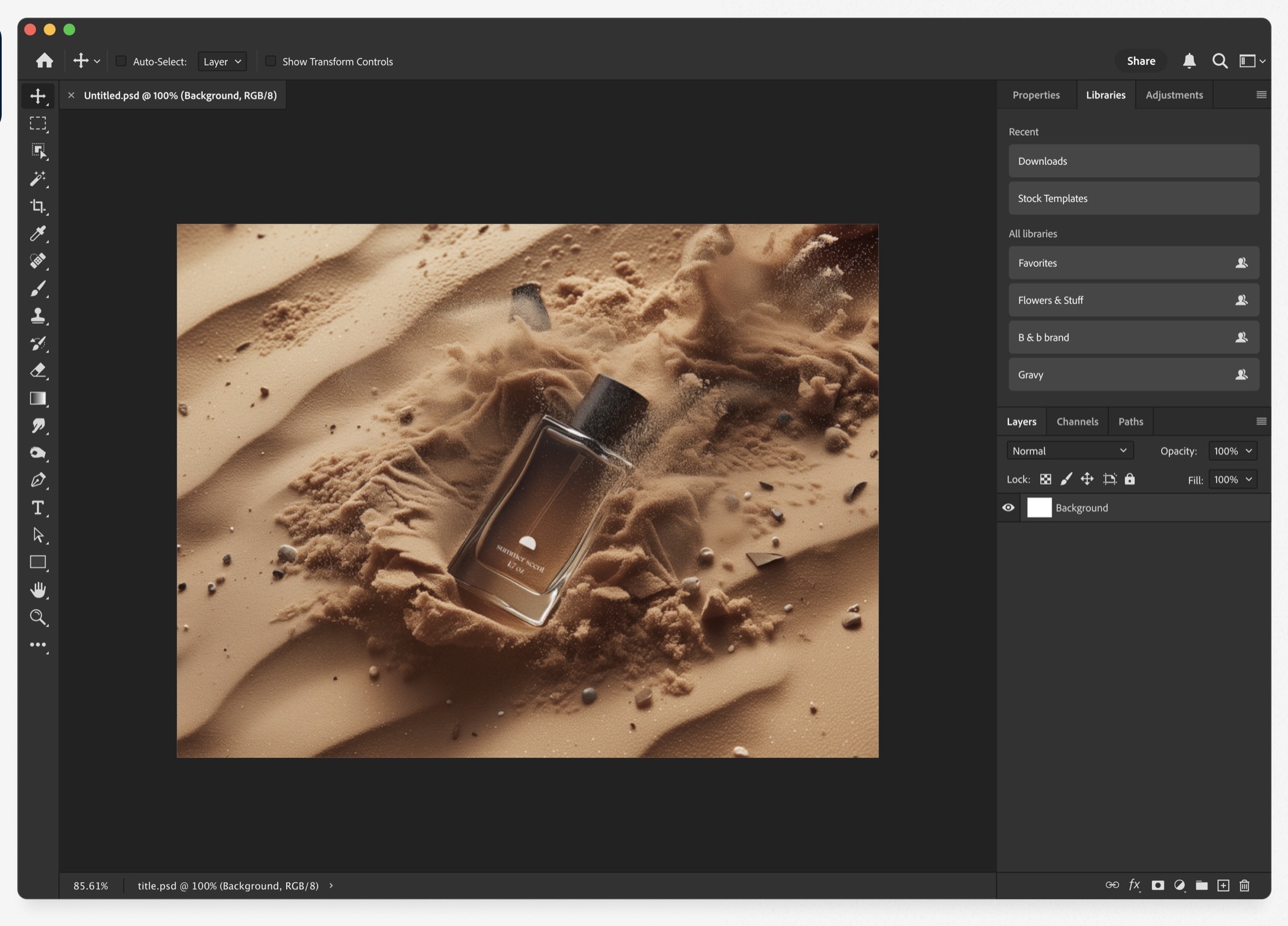 A designer working on a perfume product shot in Photoshop.